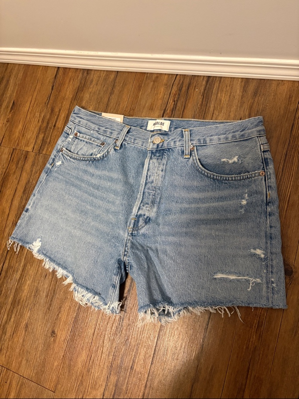 Agolde— Women's Light Blue Distressed Denim Shorts